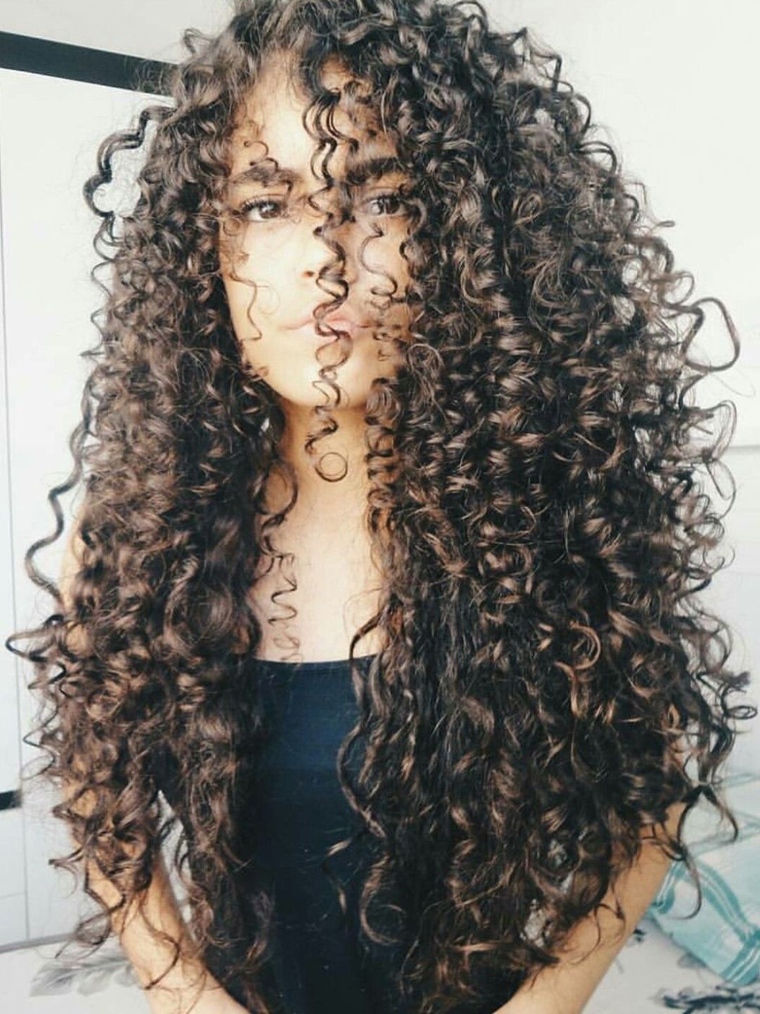 Desembaracar cabelo cacheado